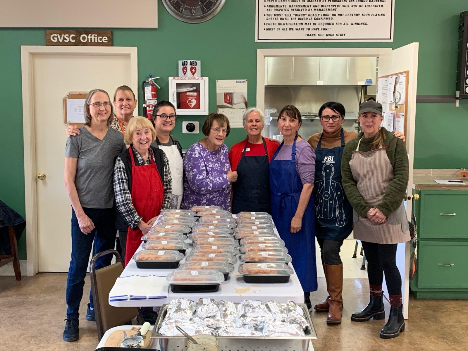 Auxiliary members prepping food.